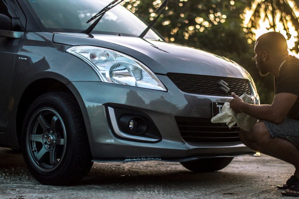 Photo of Man Cleaning His Car